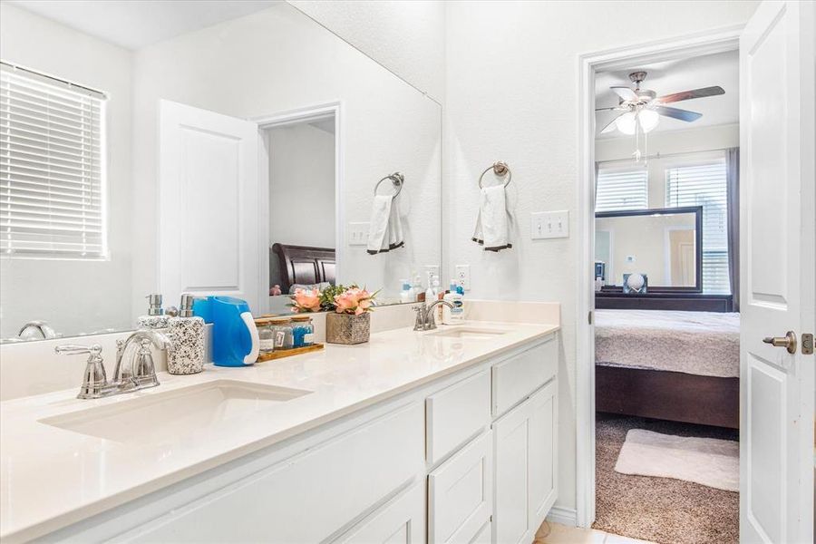 Bathroom with vanity and ceiling fan