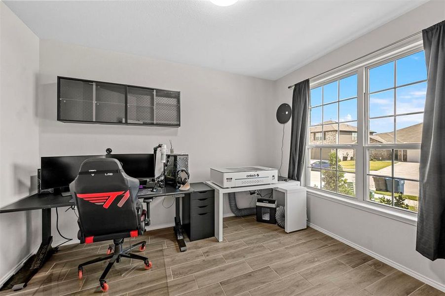 Home office with hardwood / wood-style flooring