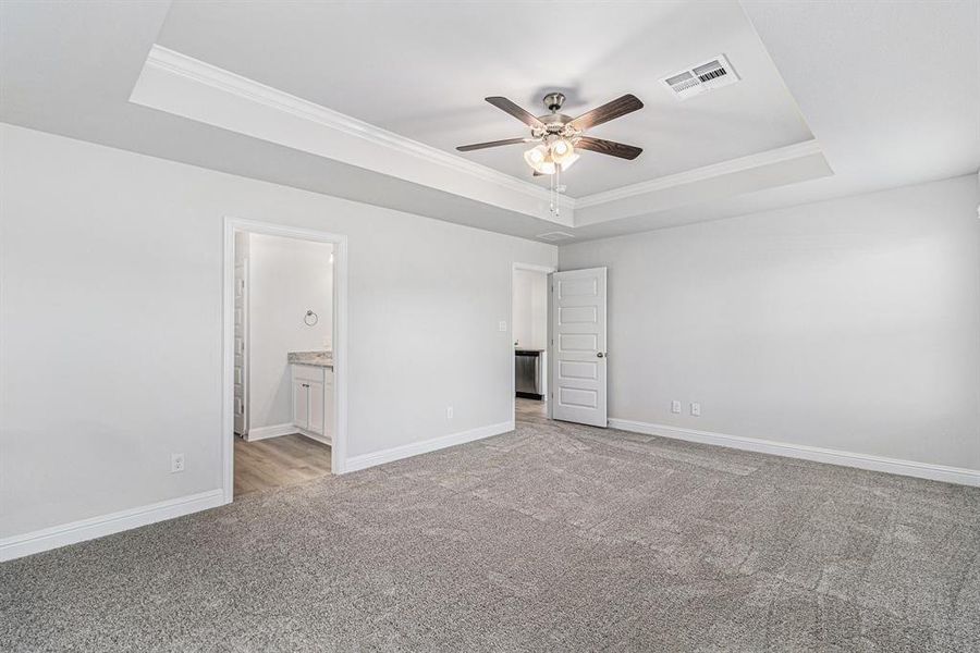 Primary Bedroom with En Suite and Tray Ceiling