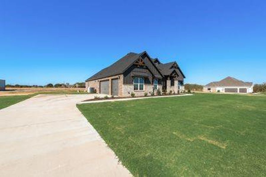 View of front of property with a front yard