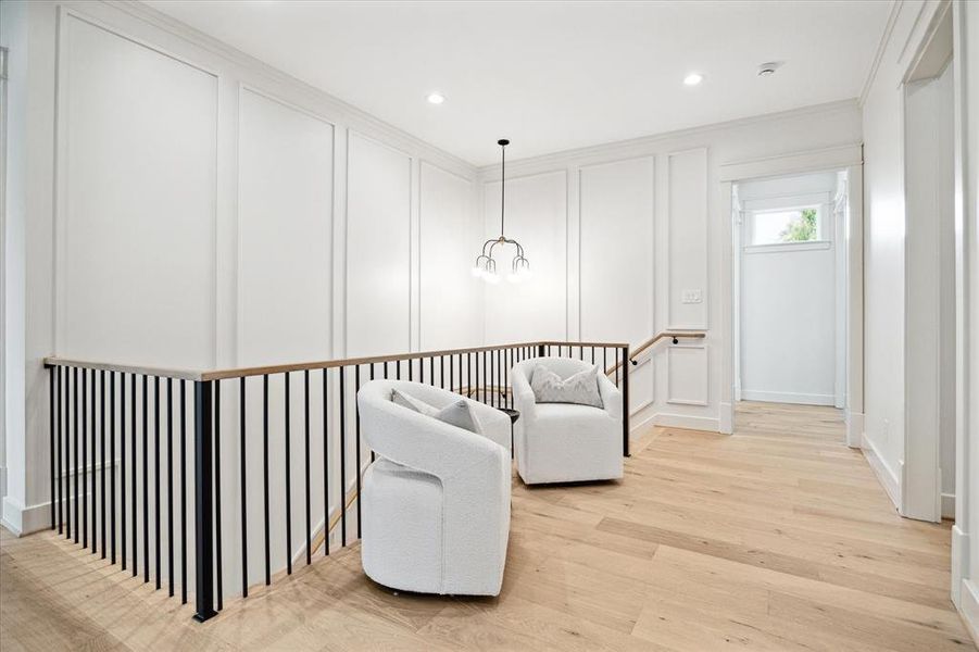 The millwork in this home is impeccable! From the moment you walk in you will notice it down the foyer and up the stairwell to the second floor. A stylish chandelier hangs above the landing