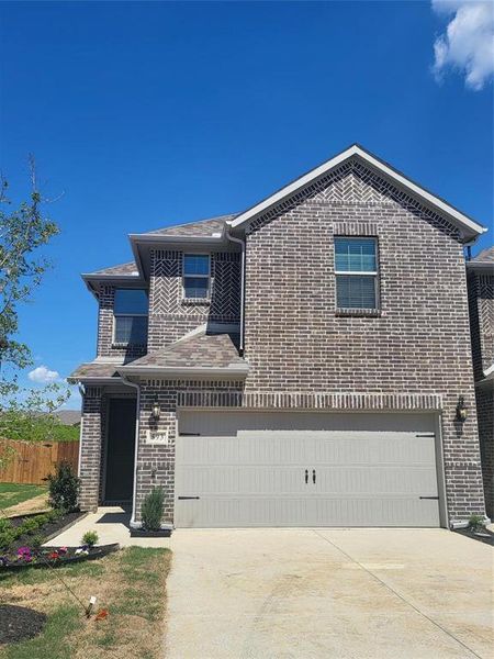 View of side of home featuring a garage