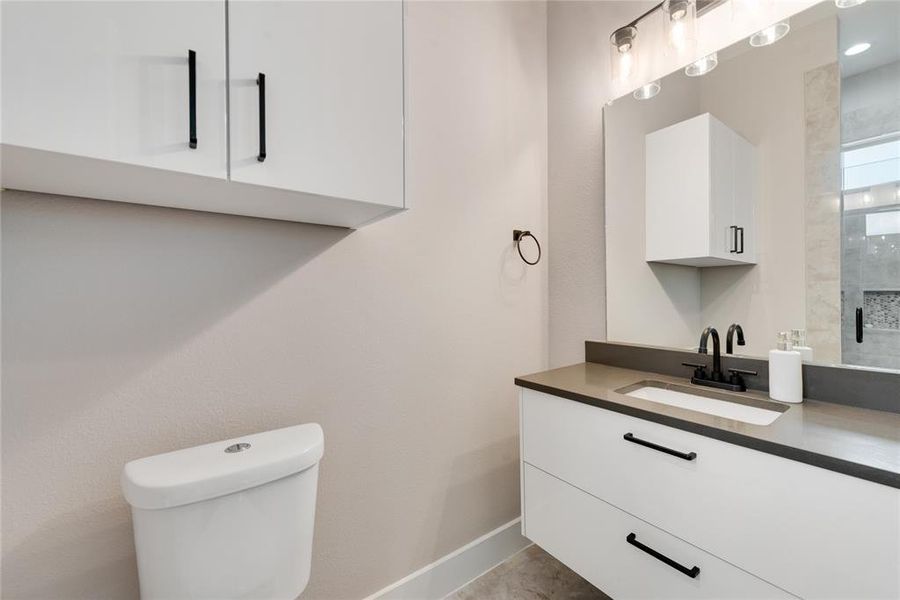 Bathroom with vanity and toilet