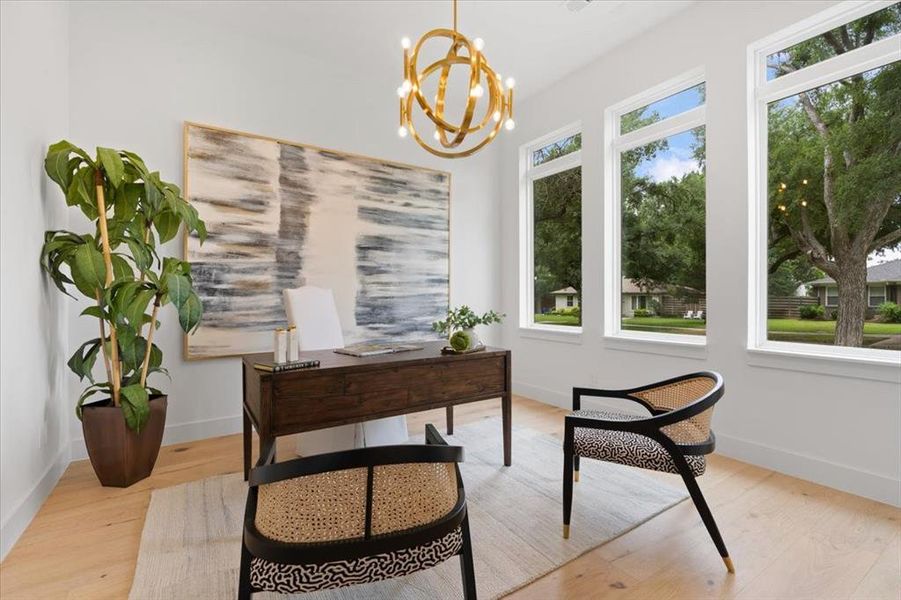 Office featuring an inviting chandelier, light hardwood / wood-style flooring, and plenty of natural light