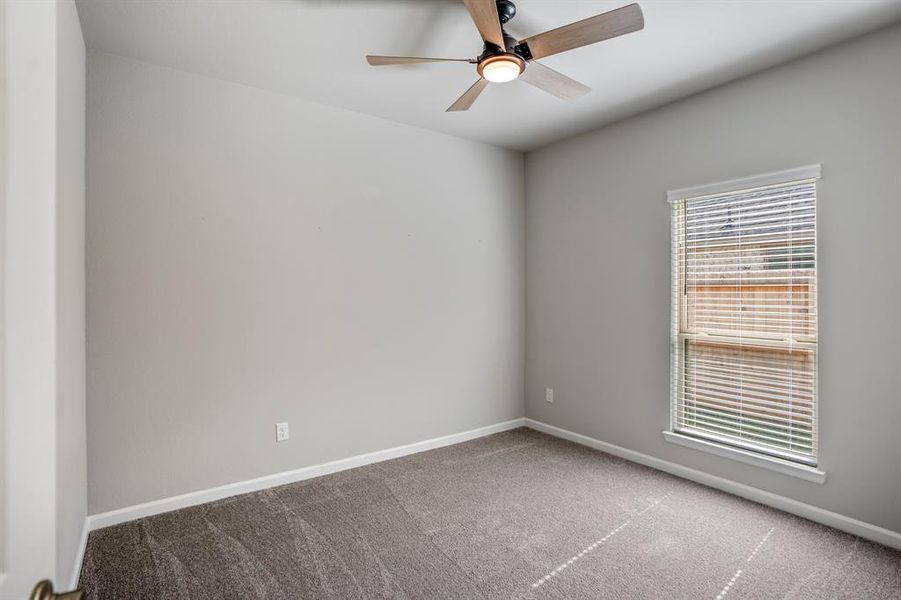 One of three secondary bedrooms