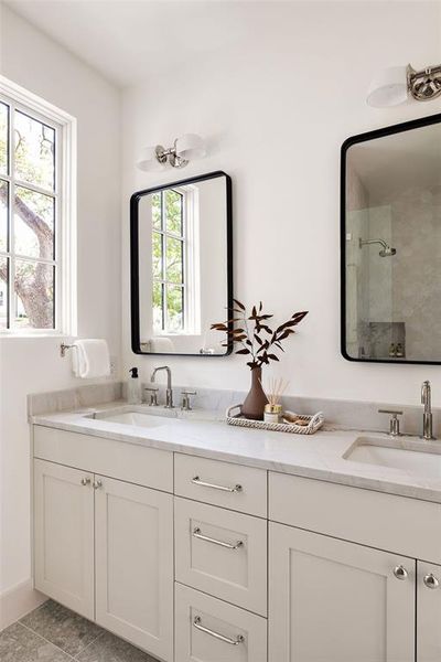 A fully decked guest bathroom with double vanities.