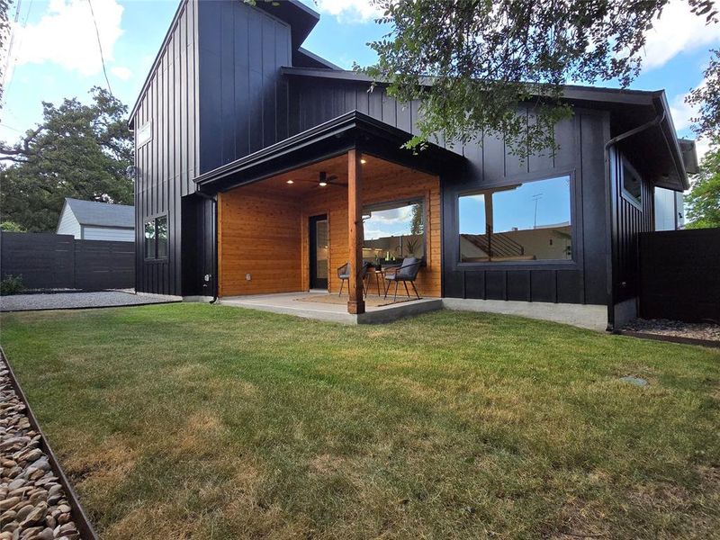 Relax on the large covered rear porch. Fan with remote control and recessed lighting as well for when the lights are wanted.