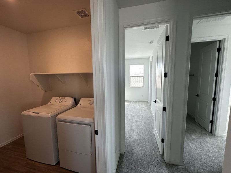 Hallway to bedrooms and laundry room