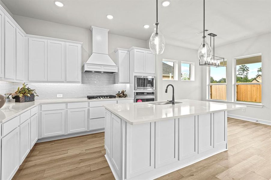 EXAMPLE PHOTO: How would you like to walk into this beautiful Kitchen every morning!  Breakfast bar with cabinets on back side of island, gas c-top, quartz counters, under cabinet lighting and double trash drawer!