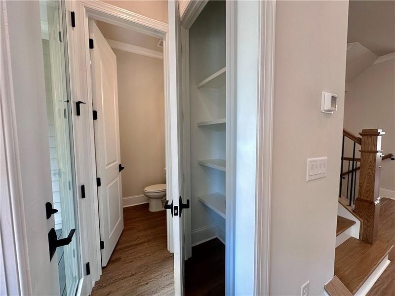 Enjoy additional storage with the pantry directly off the kitchen with powder room, and rear deck access