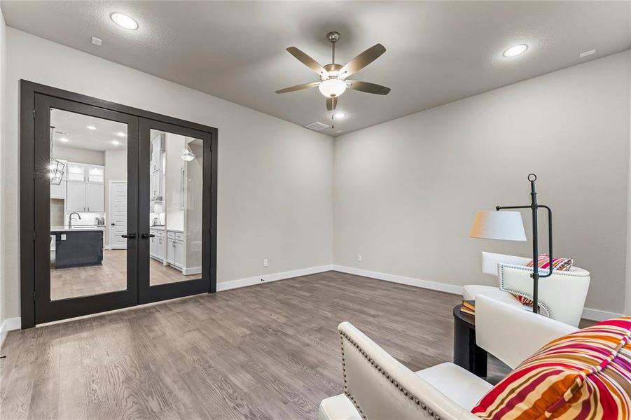 Game Room with Engineered Hardwood Flooring and Fan