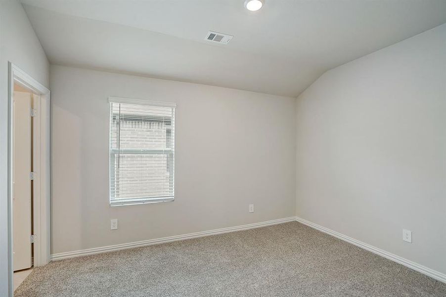 Carpeted bedroom with ensuite bath