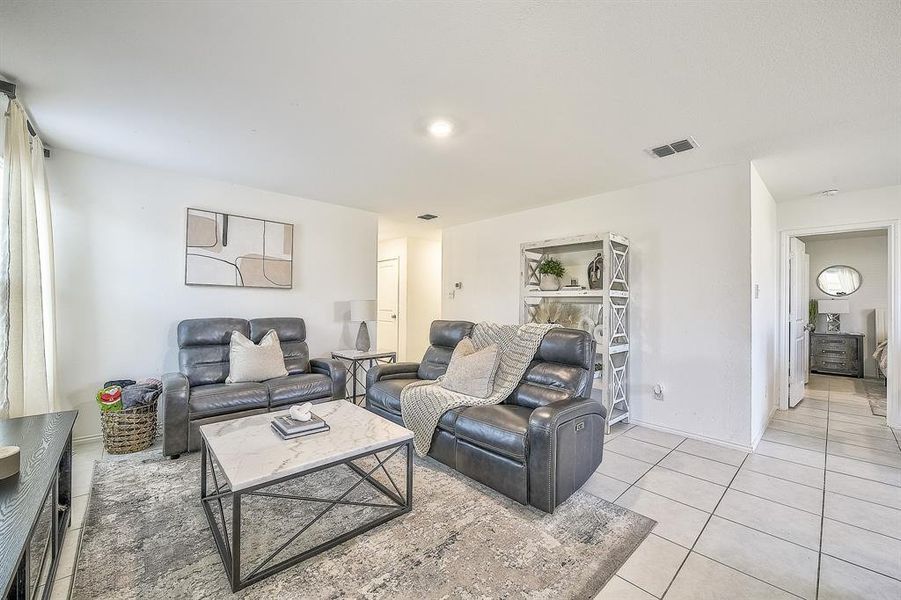 Living room with light tile patterned floors