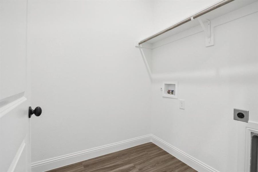 Clothes washing area featuring washer hookup, dark hardwood / wood-style floors, and electric dryer hookup