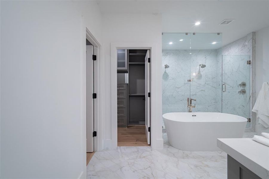 Bathroom with vanity and plus walk in shower