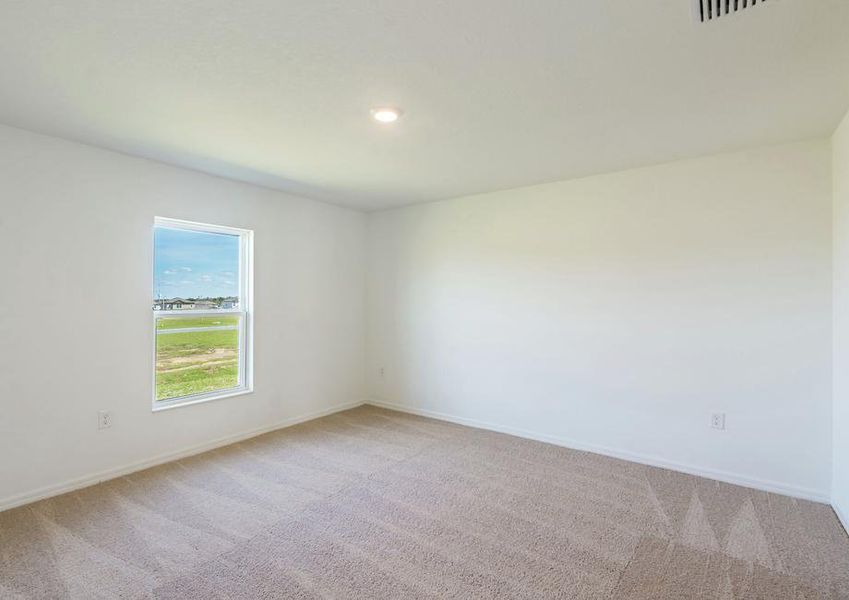 The guest bedroom is spacious and has plenty of natural light