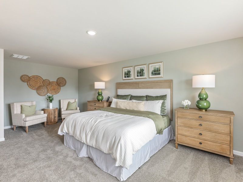 Primary bedroom in the Chatham floorplan at a Meritage Homes community in Angier, NC.