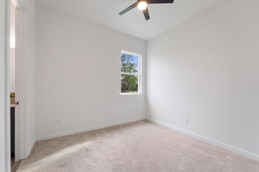 Bedroom 2 with designated Full bath, walk in closet.