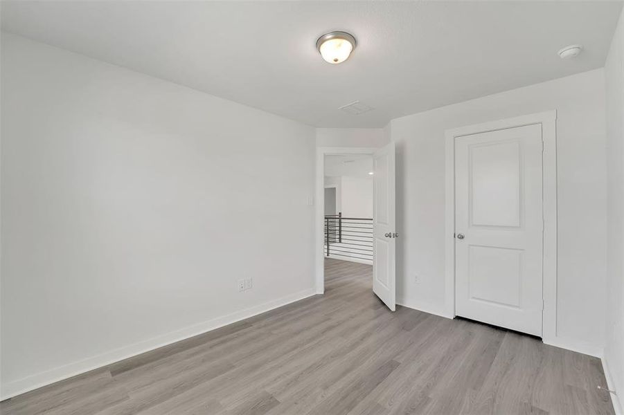 Spare room with light hardwood / wood-style flooring