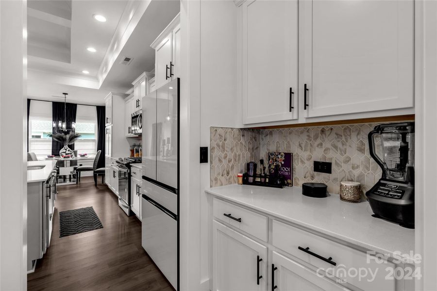 Butlers pantry leading from dining room to kitchen