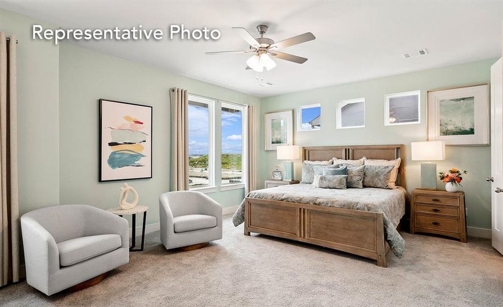 Bedroom featuring ceiling fan and light colored carpet