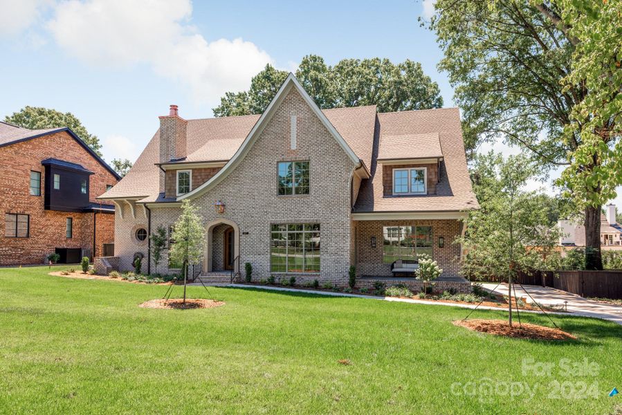 Gorgeous curb appeal and don't miss the reflection garden and fountain on the left side of the home.