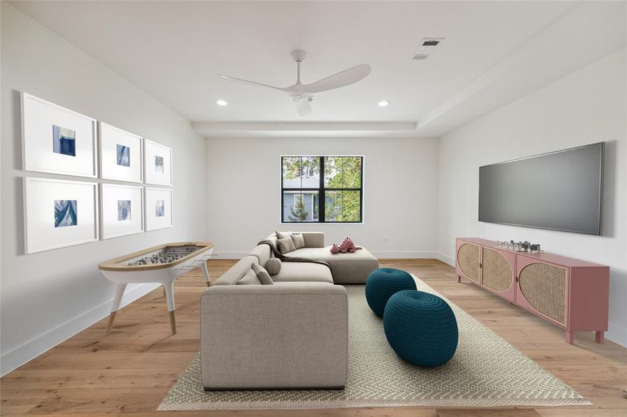 *Virtually rendered* The central second-floor game room features engineered white oak flooring and is bathed in natural light from windows providing northern exposure and views of the back lawn. The room is elegantly finished with designer neutral wall paint, a designer ceiling fan, and recessed LED lighting.