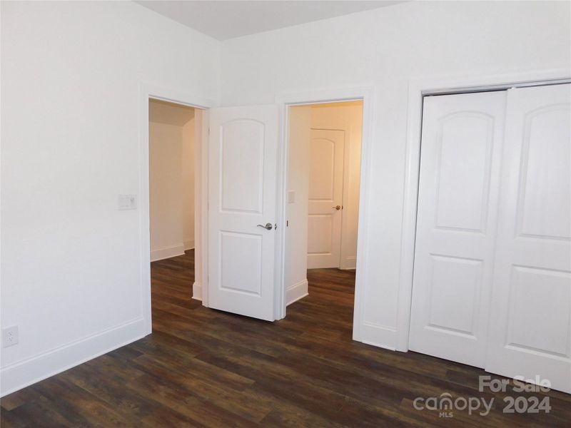 Guest Bedroom with closet and bathroom entry