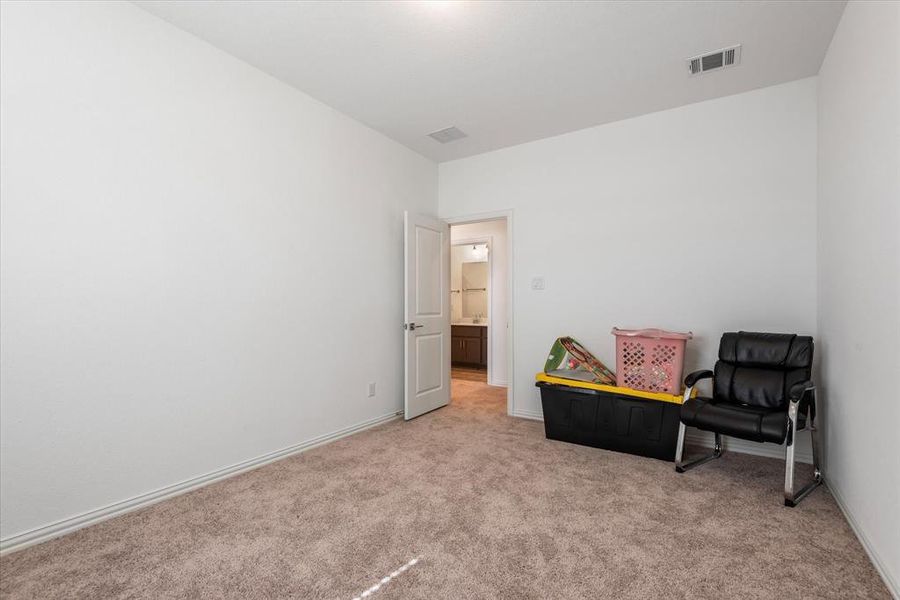 Living area with light carpet