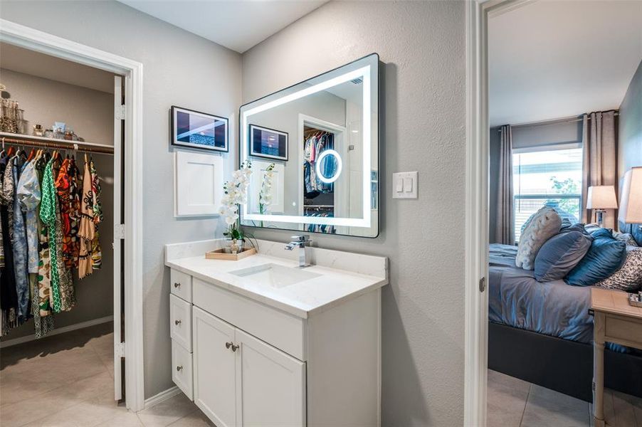 Drawers in the vanity and there are additional cabinets above the lavatory.