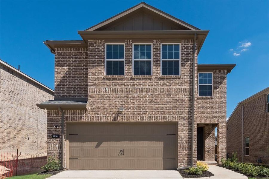 View of front of home with a garage