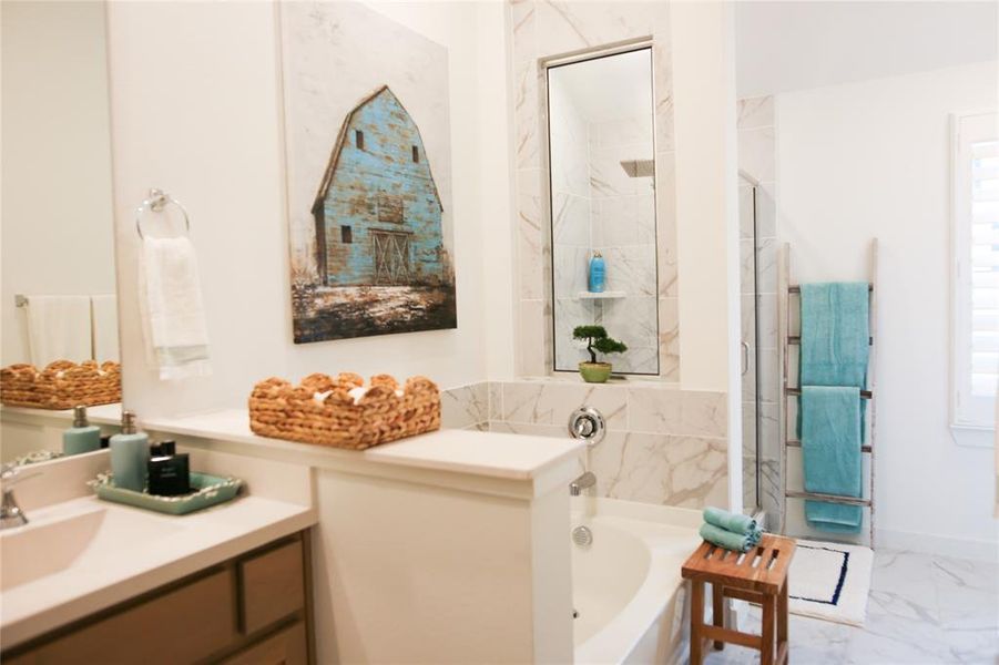 Bathroom with plus walk in shower, vanity, and tile patterned flooring