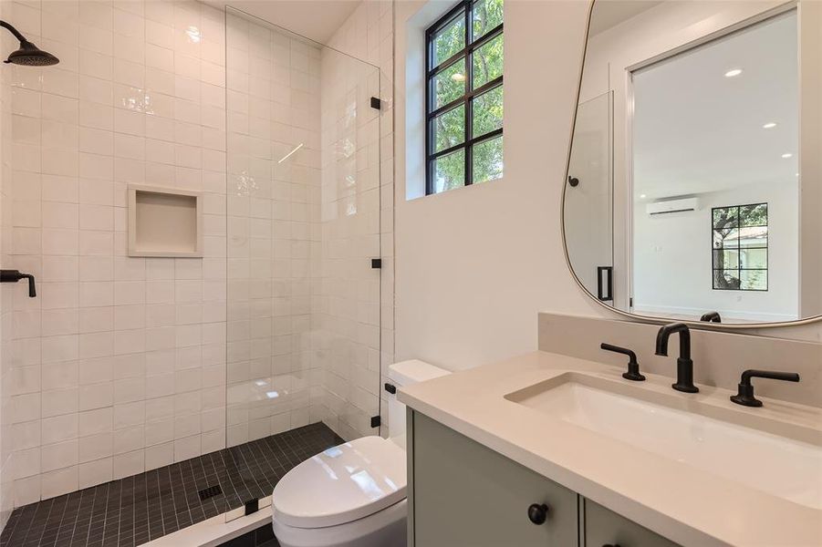 The luxurious, full bathroom, above the garage, completes the space into a true apartment, in-law suite, gym, or executive office.