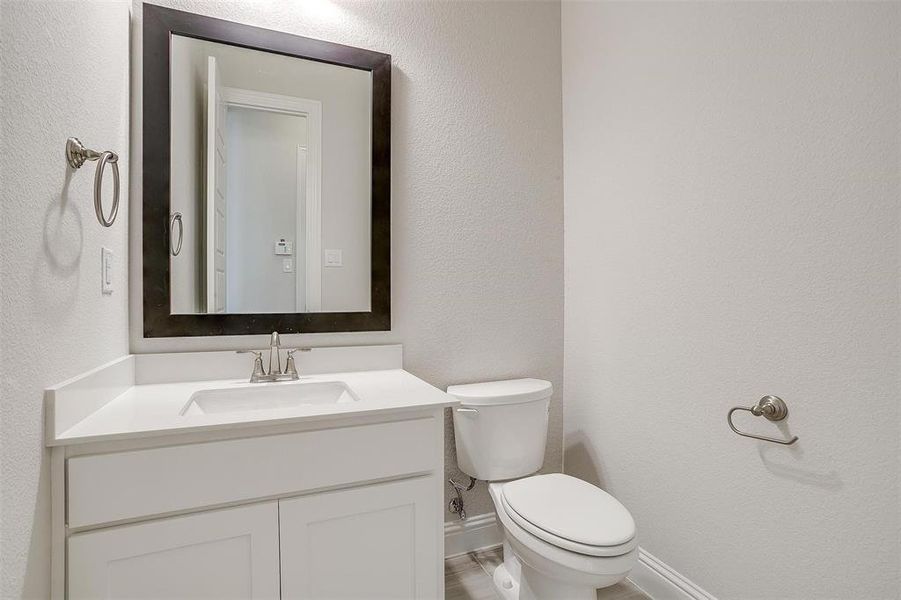 Bathroom featuring vanity and toilet