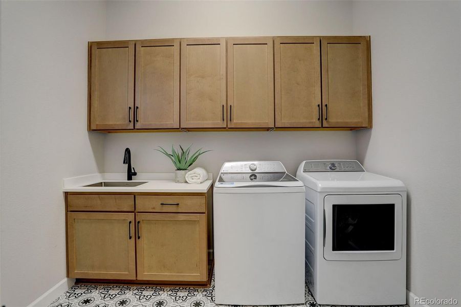 Main level laundry room, sink and cabinetry