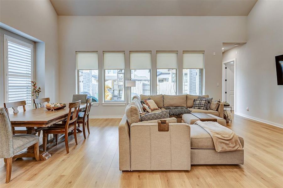 This grand living space with vaulted catherdral ceilings, French Oak wood floors is the perfect space to host large gatherings.