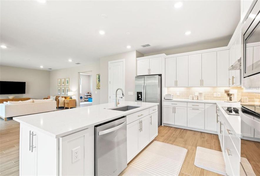 The kitchen is open to the family room.