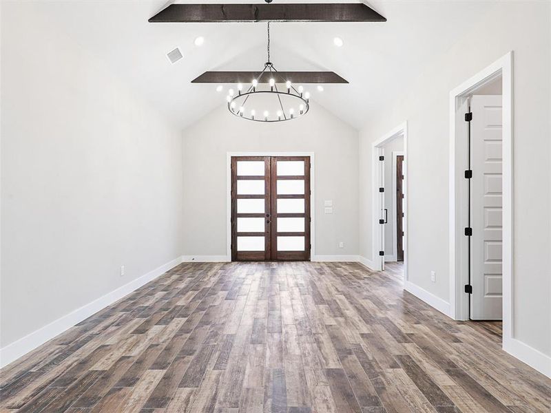 Step inside, and you're greeted into a spacious foyer with 10-foot ceilings and exquisite 8-inch doors.