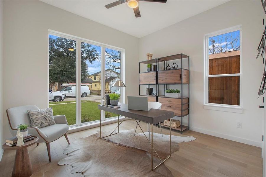 Office space featuring light hardwood / wood-style floors and ceiling fan