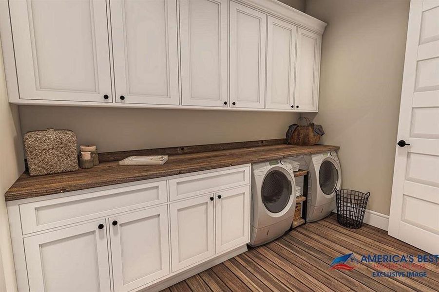 Washroom with washing machine and dryer, dark wood-type flooring, and cabinets
