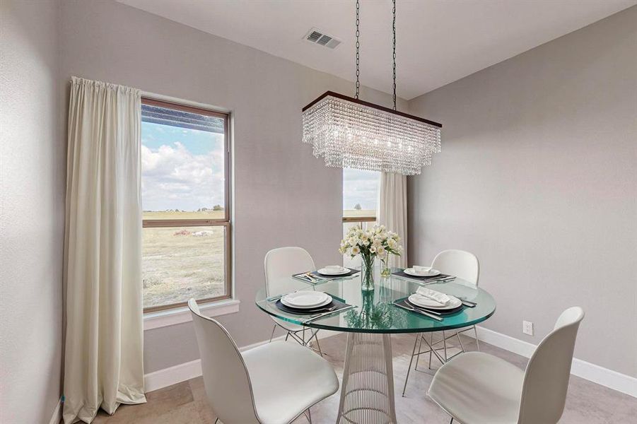 Virtual Dining room with light tile patterned flooring and an inviting chandelier