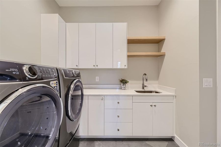 Laundry connected to primary closet!