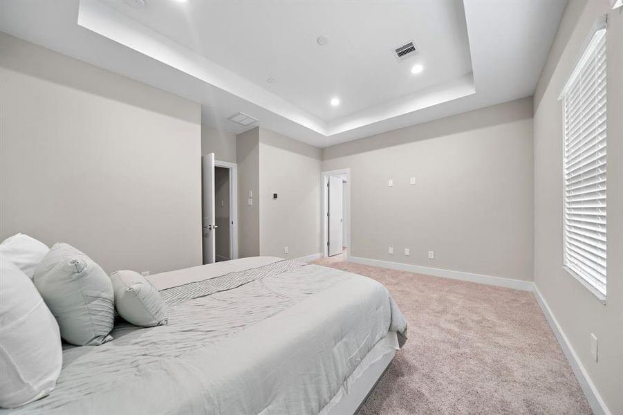 Primary Bedroom is HUGE and offers tons of space to retreat to, recessed lighting and Trey ceilings.