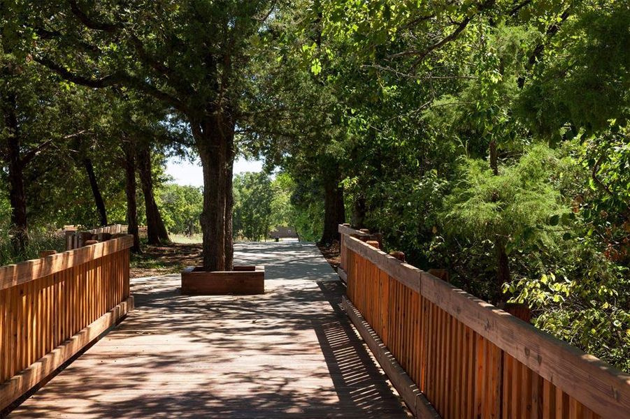 Paved boardwalk that includes direct access to the North Shore trail, which is made up of 22 miles of unpaved moderate hikng/biking trail along Lake Grapeving