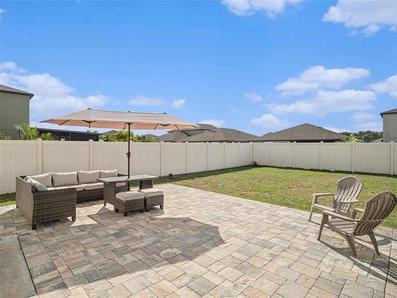 Very Large Backyard with 22" pavers. Doors on both sides.