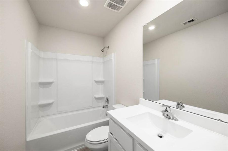 The secondary bathroom has a shower/tub combo to provide guests with a comfortable and accommodating stay.