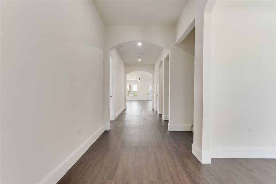 Hallway featuring dark hardwood / wood-style floors