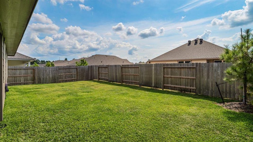 Fenced in back yard is perfect for children or pets.