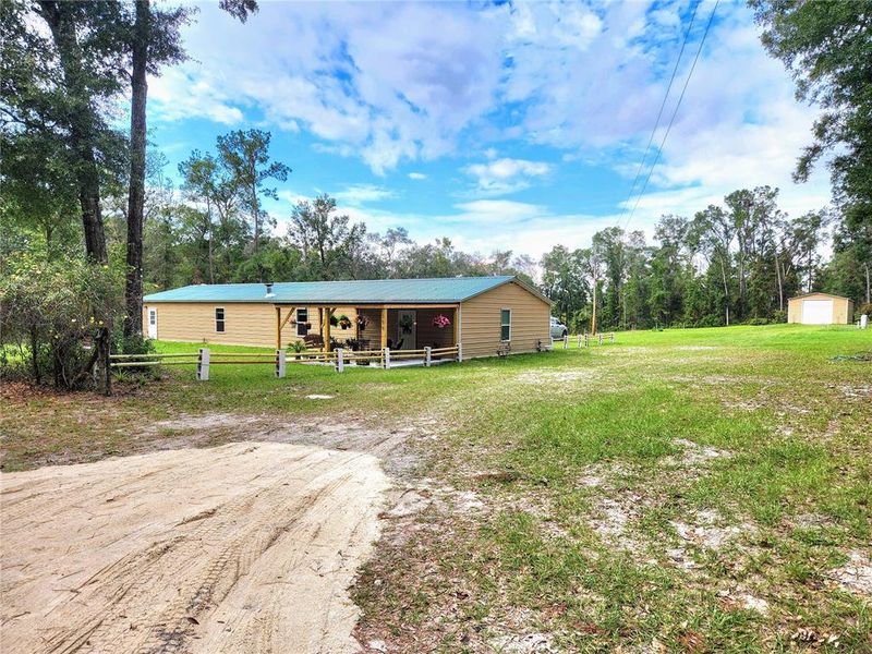 30x90 Steel home with front porch and 24x60 Pool barn with 12x12 roll up door