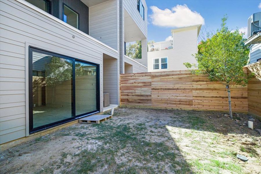 Backyard and rear facade of 1524 Welch St